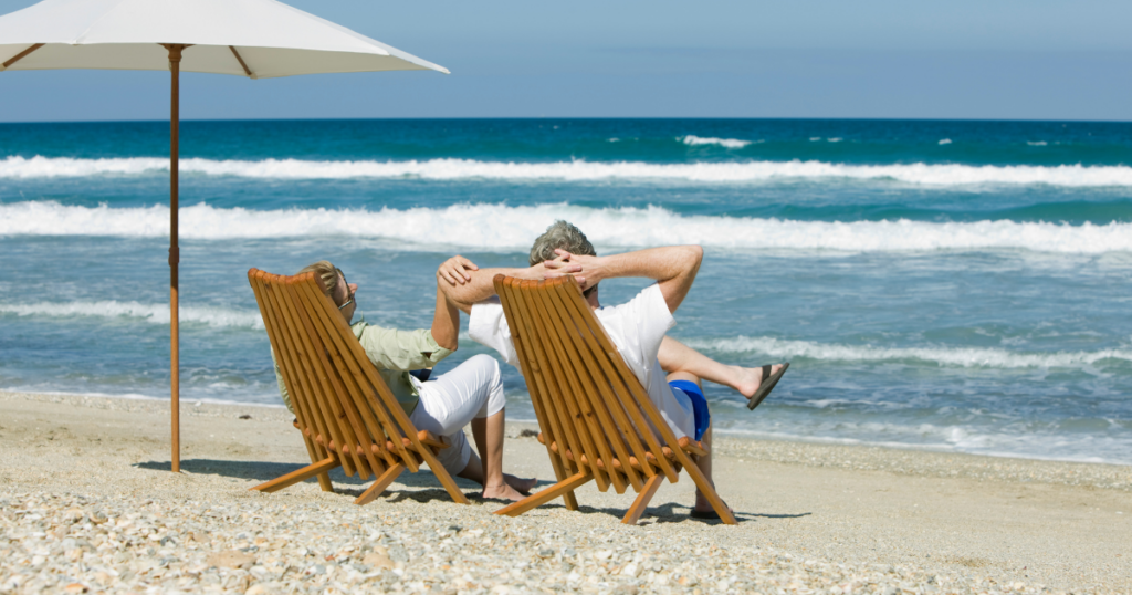 retired couple enjoying life on the beach