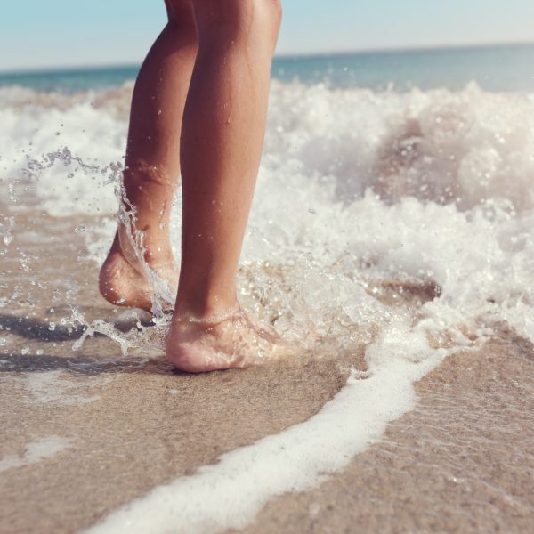 Jumping in the sea waves on the beach